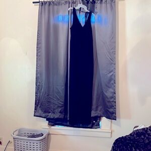 Black romper with strappy back.